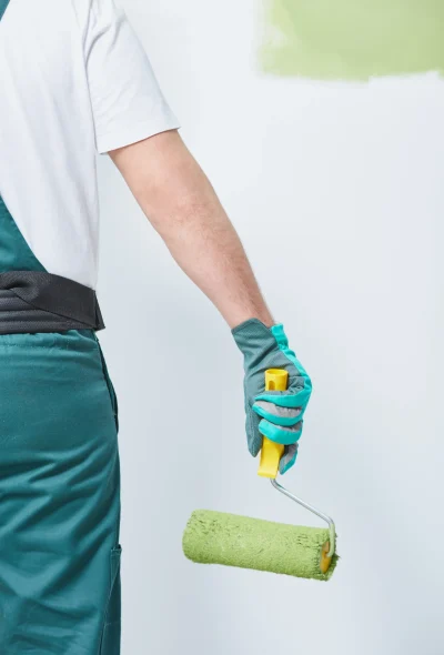 house-painter-using-green-paint-roller-indoors-2026-01-05-06-23-16-utc